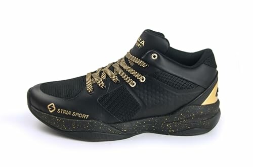 Black and gold sport shoe with speckled sole and patterned laces.