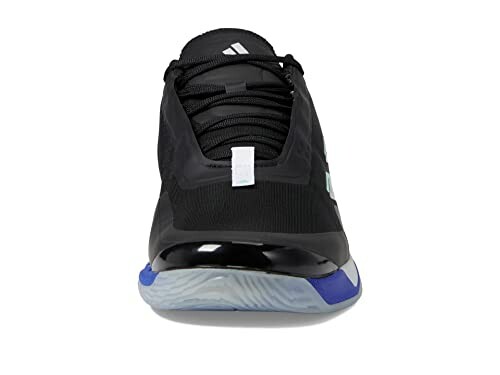 Front view of a black sneaker with blue and white accents.