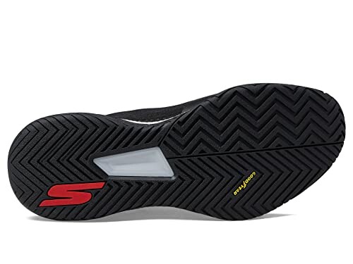 Bottom view of a black sneaker sole with tread pattern