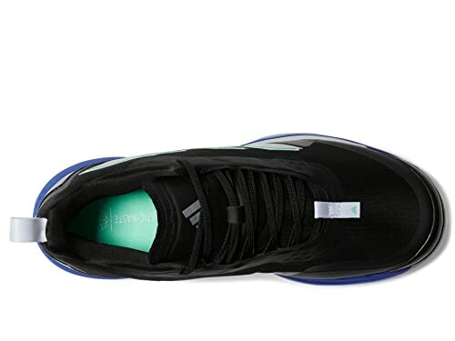 Top view of a black sneaker with blue and white accents.