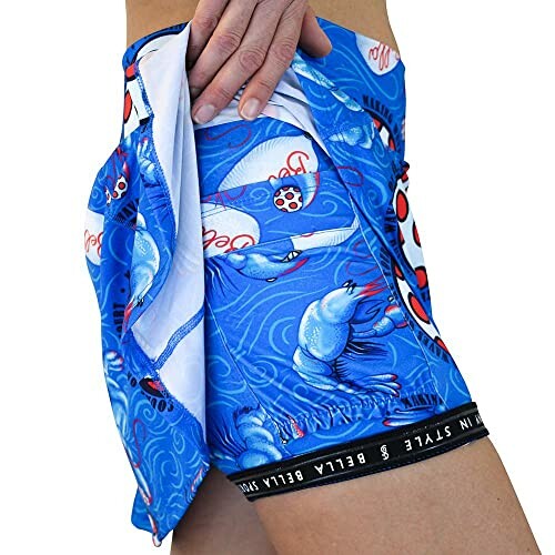 Person wearing blue boxer shorts with dolphin design