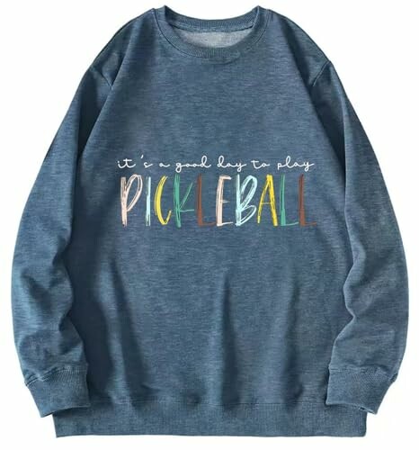 Blue sweatshirt with 'It's a good day to play pickleball' text