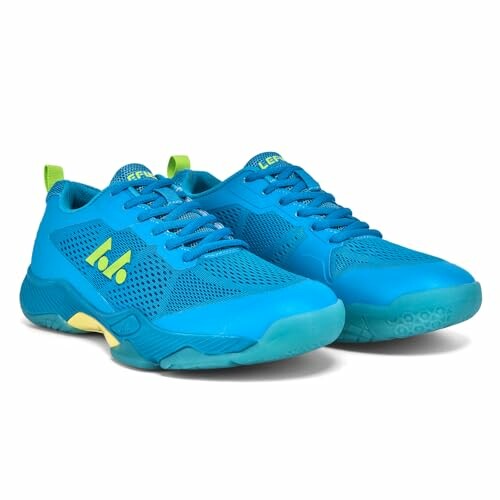 Pair of blue sports shoes with green accents