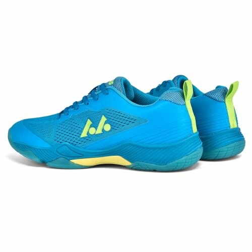 Pair of blue athletic shoes with yellow accents