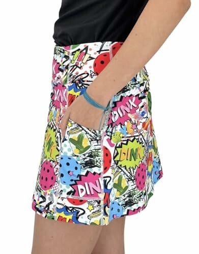 Side view of a colorful comic-pattern skirt with pockets