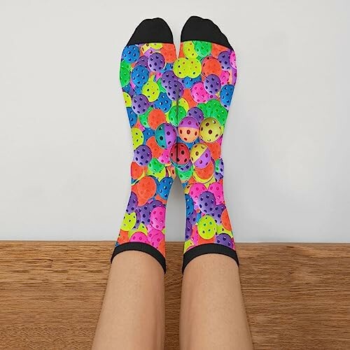 Feet wearing colorful socks with smiley faces