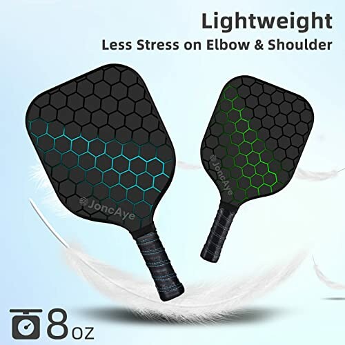 Two lightweight pickleball paddles with hexagonal patterns and text about reduced stress on elbow and shoulder.