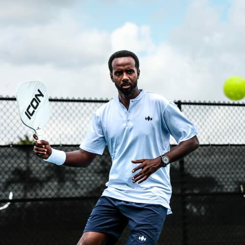 Man playing pickleball on a court