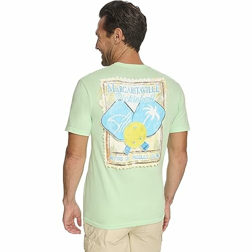 Man wearing a Margaritaville Pickleball t-shirt with a graphic on the back.