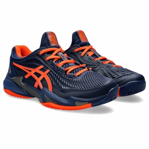 Navy blue and orange athletic sneakers