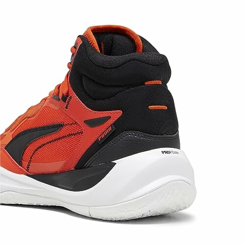 Orange and black sports shoe with white sole