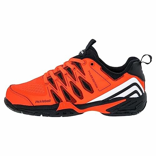 Bright orange pickleball shoe with black and white accents.