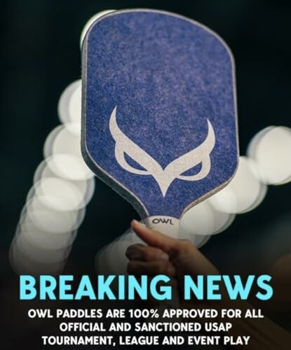 Hand holding an OWL paddle with breaking news announcement.