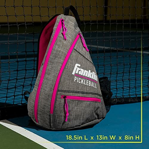 Pickleball backpack with pink accents on a court