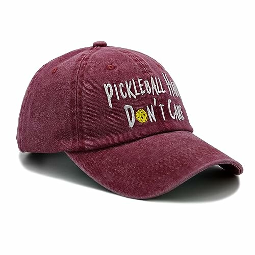 Maroon baseball cap with 'Pickleball Hero Don't Care' text.