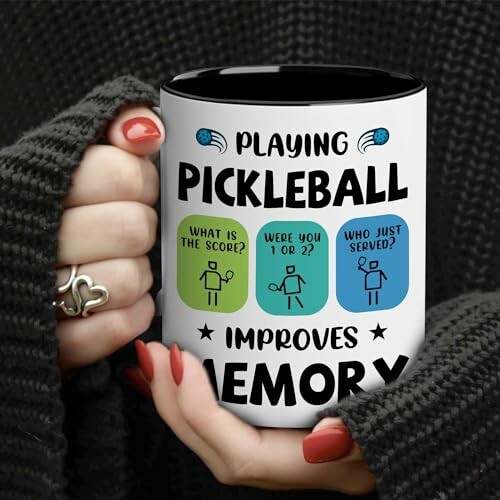 Person holding a mug with funny pickleball memory quotes.