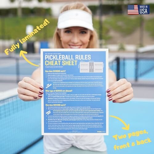 Woman holding a Pickleball Rules Cheat Sheet on the court.