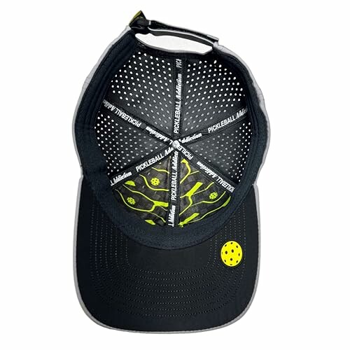 Inside view of a pickleball-themed cap with yellow ball design.