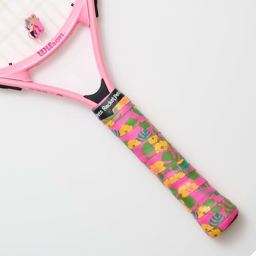 Pink tennis racket with colorful floral grip