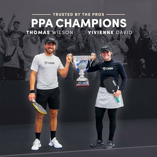 Thomas Wilson and Vivienne David holding a trophy as PPA champions.