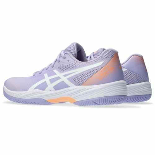 Pair of purple tennis shoes with white and orange accents.