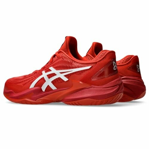 Red athletic sneakers with white logo design.