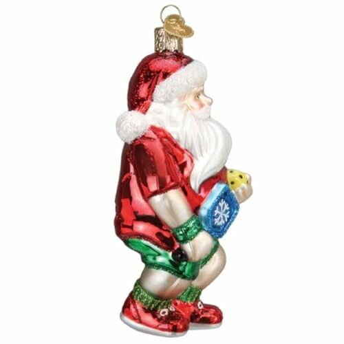 Santa Claus figurine holding a small gift.