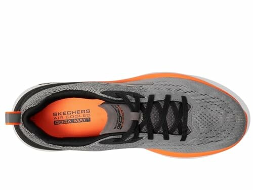 Top view of a gray and orange Skechers sneaker with black laces.