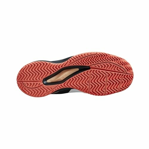 View of a sneaker's sole with red tread pattern