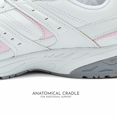 Closeup of white and pink sneaker with anatomical cradle for support