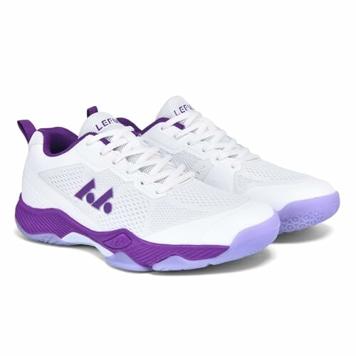 White and purple sports shoes with mesh design.