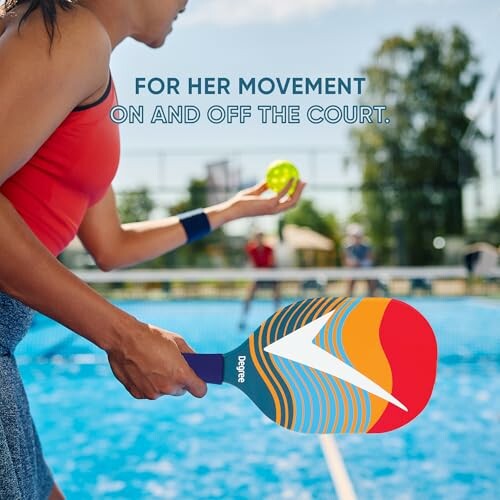 Woman playing pickleball on outdoor court