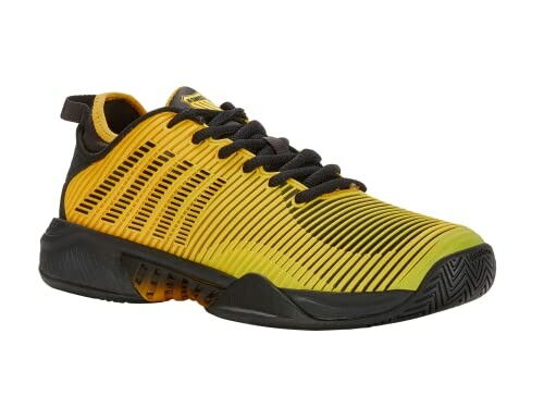 Yellow and black sports shoe with striped design